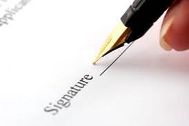 signature line with someone beginning to sign the line