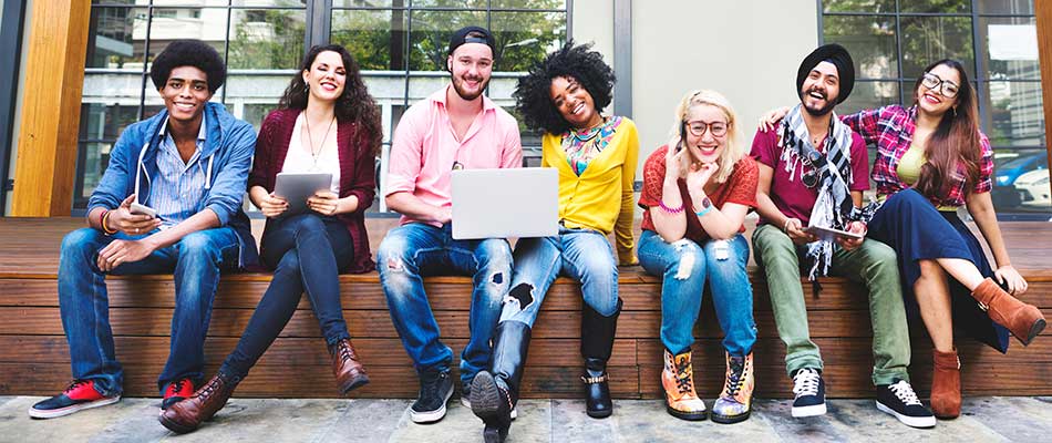happy students sitting in a row