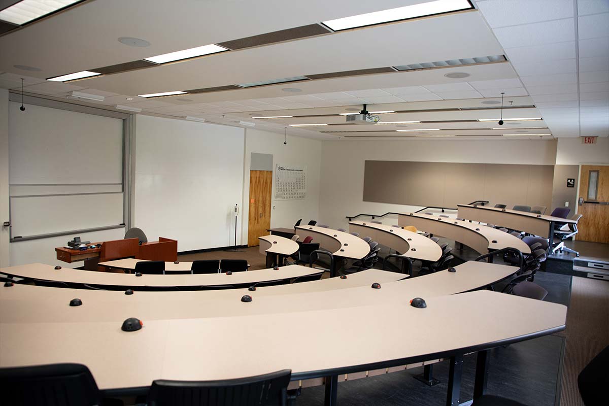 UC high tech tiered classroom looking at the board