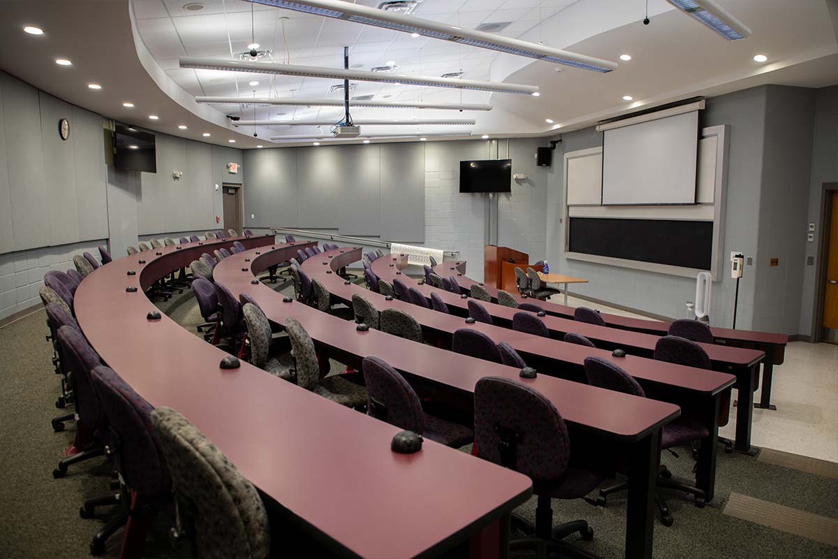 Lecture Hall high tech tiered classroom looking at the board
