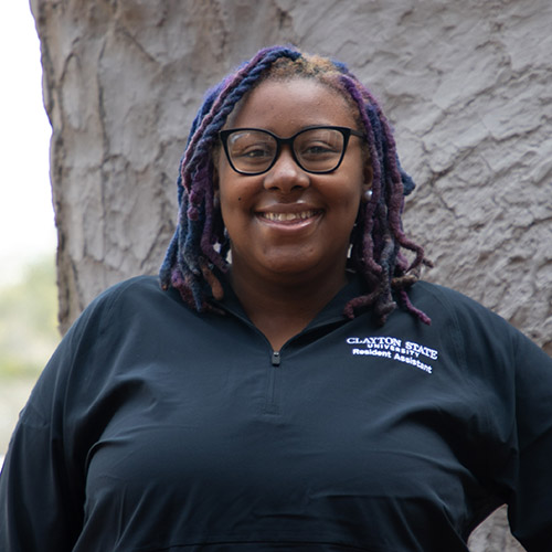 Image of Bethany Jennings wearing a CSU Resident Assistant polo-style shirt