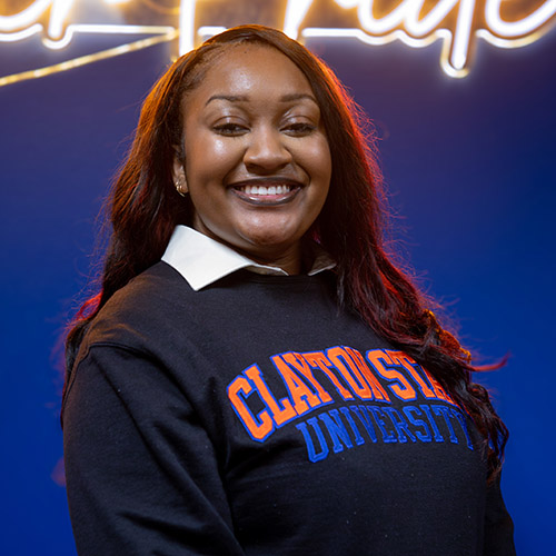 Image of Laura Vickers, wearing a black Clayton State swearter with a white dress shirt underneath