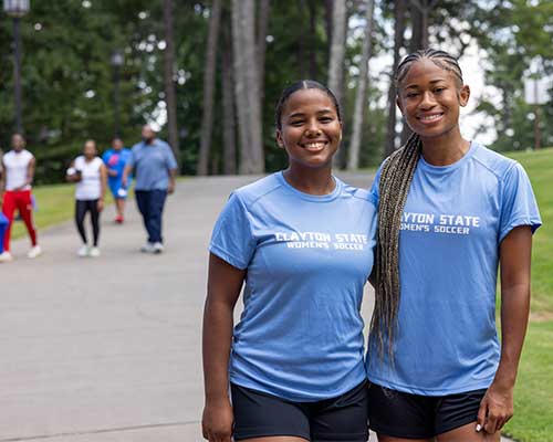 two female athletes at move in