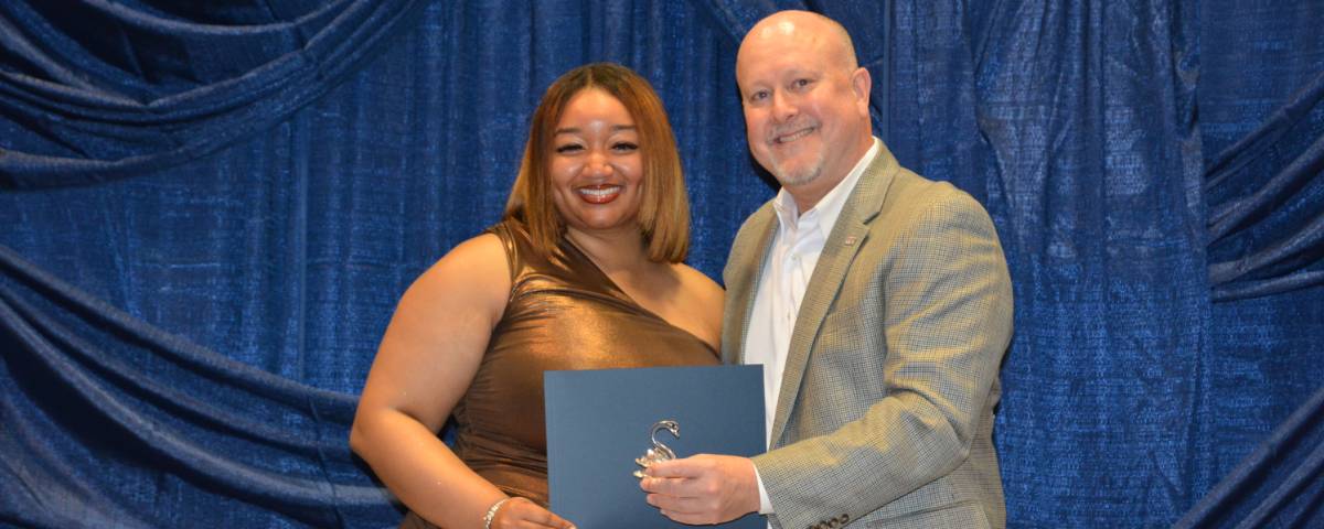 Image of Jeff Jacobs, presenting the Jeff Jacobs leadership award to winner Morgan Dent
