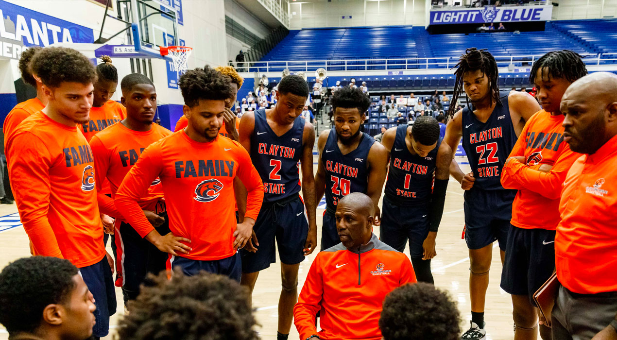 men's basketball game huddle