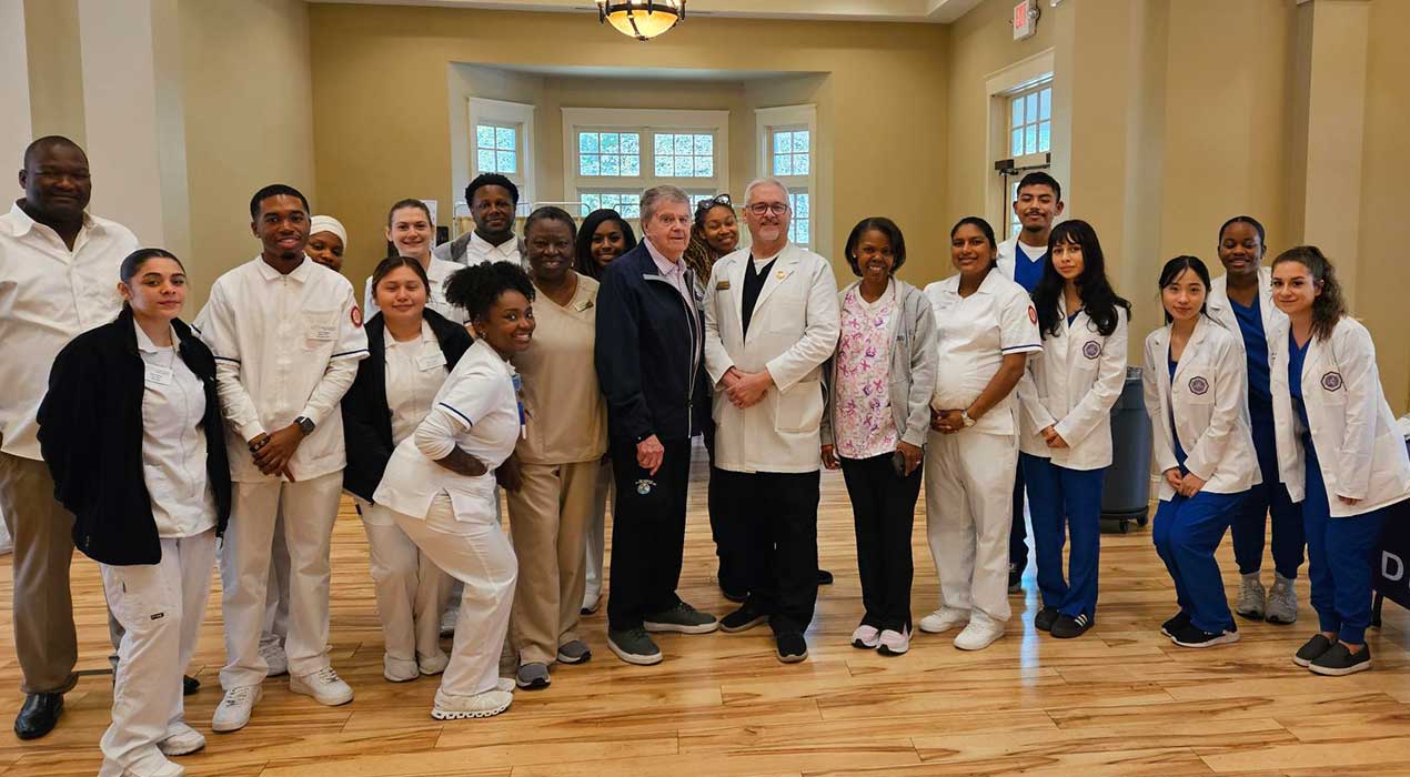 Students gather with College of Health Dean Dr. Dwayne Hooks and Lake City Mayor Ronald Dodson