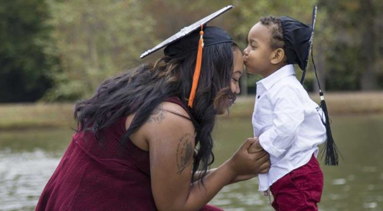 A Clayton State student parents celebrates graduation with her son