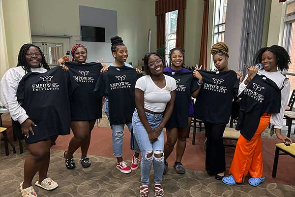 empowerher group with shirts