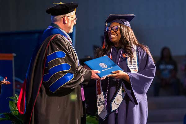 graduate receiving diploma