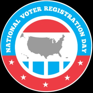 The National Voter Registration Day logo features a circular design with a blue outer ring containing white text that reads "National Voter Registration Day." Inside the circle, there is an image of the continental United States in gray, placed against a background with red, white, and blue elements. The upper section of the inner circle has a red stripe, while the bottom consists of alternating blue and white squares resembling a flag. Surrounding the bottom part of the logo are white stars against the red background, aligning with a patriotic theme.